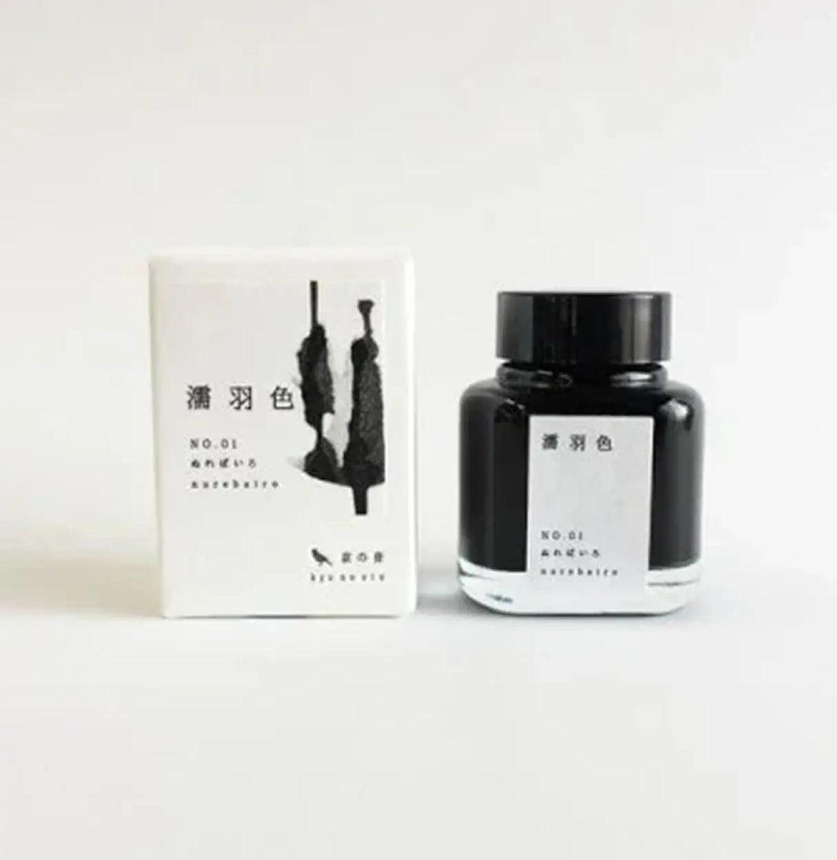 Ink bottle and packaging with black and white design on a white background